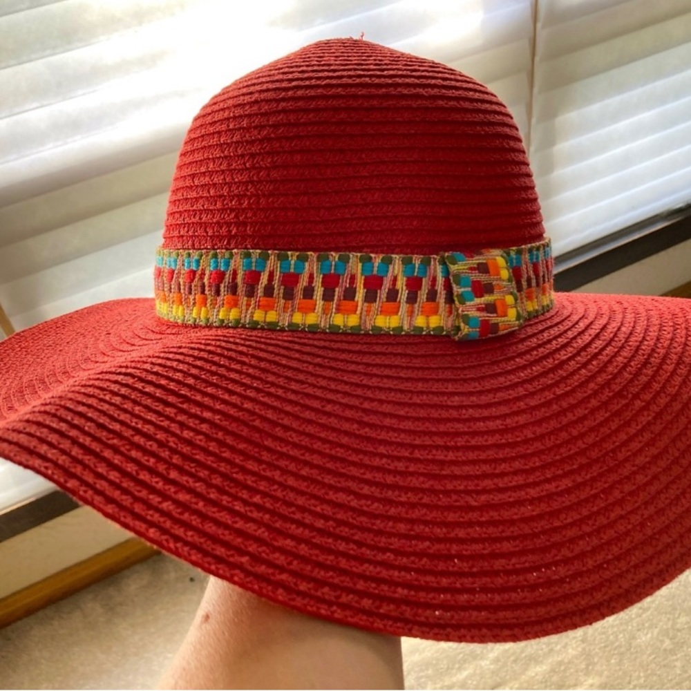Red hat, never worn, perfect to keep the sun off your face